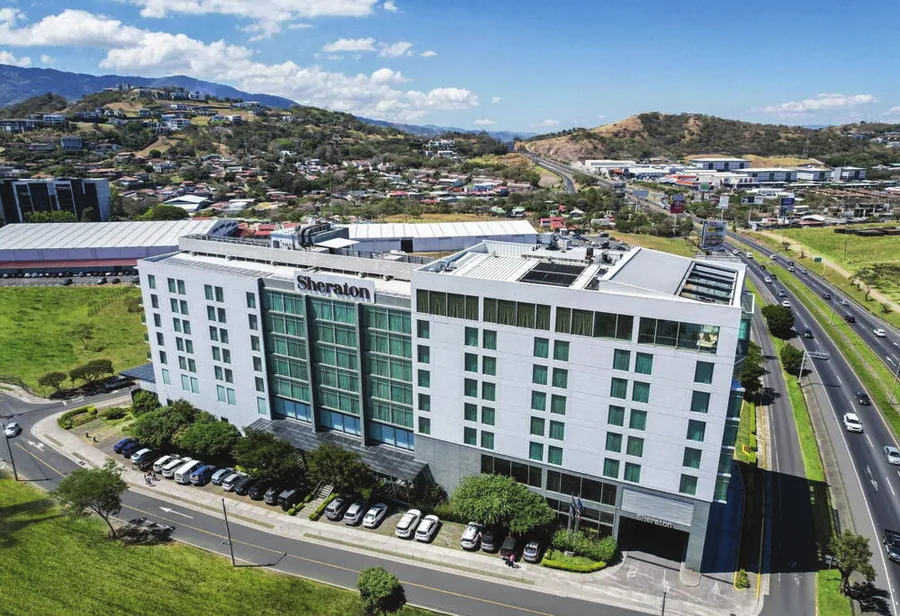 Sheraton San José Hotel with the valley behind it