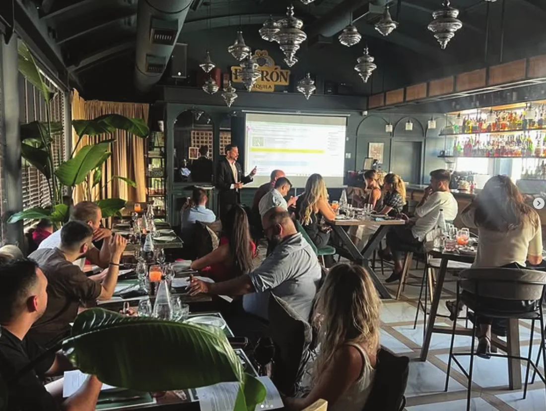 Attendees at a The Cigar Academy session in a cigar lounge